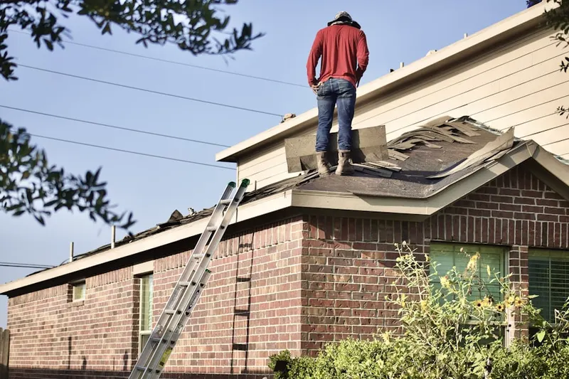 Professional roofer working on a residential roof in Hillsmere Shores
